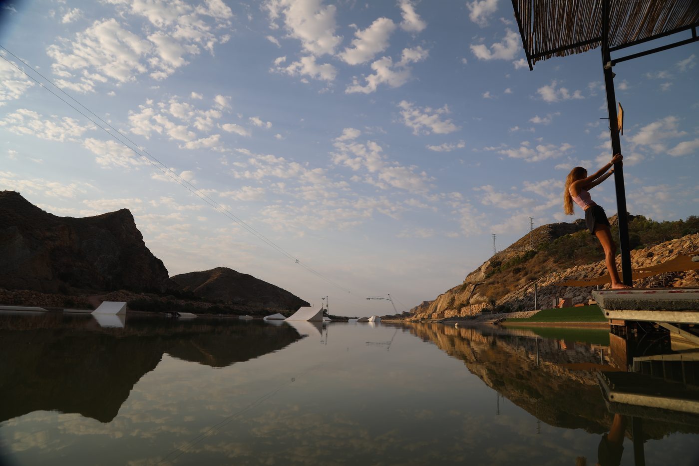 Sunset view of Lunar Cable Park lake and mountains